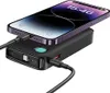 A black power bank is charging a purple smartphone. Náhled obrázku produktu
