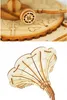 Close-up shots of wooden puzzle pieces, one showing a detailed wheel and the other a fan-like structure. Podgląd zdjęcia produktu