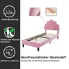 A pink bed frame with a shell-shaped headboard is shown against a white background, with informational graphics on the left. Voir les images du produit