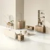 A staged room setting with various furniture pieces, including a sofa, side table, dresser, and shelving unit, all in a natural oak finish. Podgląd zdjęcia produktu