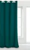 A teal curtain hangs in front of a window. Produktbild-Vorschau