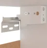 Close-up of a metal bracket being attached to a white cabinet with screws. Voir les images du produit