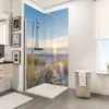 A modern bathroom with a corner shower featuring a scenic beach sunset print on the glass panels. Produktbild-Vorschau
