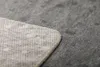 A close-up view of the corner of a blanket, showing the texture of the fabric and the stitching. Produktbild-Vorschau