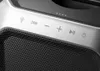 A close-up view of the control panel and speaker grille of a portable speaker. Produktbild-Vorschau