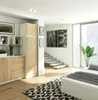 A modern bedroom with a wardrobe, stairs, and a large window. Náhľad obrázku produktu