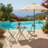 A table and chairs set with breakfast items next to a swimming pool with a view of the ocean. Anteprima dell’immagine prodotto
