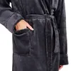 A close-up shot of a person wearing a gray robe, with their hand in the pocket. Produktbild-Vorschau