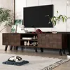 A modern living room scene featuring a dark wood TV stand with a television on top and decorative items. A cat is sleeping on a mat in the foreground. Produktbild-Vorschau