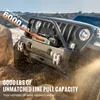 A winch on a Jeep is pulling a vehicle out of the mud. Anteprima dell’immagine prodotto