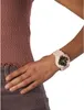 A close-up shot of a person's wrist wearing a pink Casio G-Shock watch. Produktbild-Vorschau