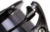 A close-up shot of a fishing reel spool and part of the handle. Produktbild-Vorschau