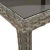 Close-up of the corner of a grey rattan garden table with a glass top. Náhled obrázku produktu