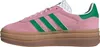 A side view of a pink Adidas Gazelle sneaker with green stripes and a thick brown sole. Produktbild-Vorschau