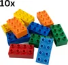A collection of colorful building blocks scattered on a white background. Produktbild-Vorschau