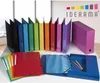 A collection of office binders and folders arranged on a table. Produktbild-Vorschau