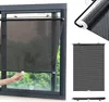 Collage of images showing a black roller blind with suction cups for window mounting, including a close-up of the fabric and a hand adjusting the blind. Voir les images du produit