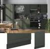 A modern kitchen with green cabinets, a dining table and chairs, and a close-up of a cabinet base. Anteprima dell’immagine prodotto