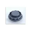 A close-up, centered shot of a gray plastic cap with a textured edge and a circular top. Náhľad obrázku produktu