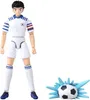 A figurine of a soccer player in a white uniform with blue and red accents, standing next to a soccer ball with a blue splash effect. Produktbild-Vorschau