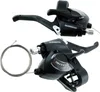Two black bicycle gear shifters and a coiled bicycle cable against a white background. Anteprima dell’immagine prodotto