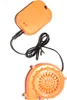 An orange battery pack and fan for an inflatable costume. Produktbild-Vorschau