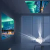 A room with projectors displaying the aurora borealis on the wall and ceiling, with a person visible in the projected image. Náhled obrázku produktu