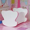 A dollhouse bed with pink trim in a dollhouse room. Produktbild-Vorschau