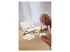 A person is writing a letter with a calligraphy pen, with a calligraphy set and stationery on a wooden desk. Produktbild-Vorschau