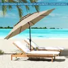 A beach scene with two lounge chairs and a large umbrella. Anteprima dell’immagine prodotto