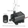 A small black submersible water pump with water flowing out of the outlet, next to a strainer attachment. Dimensions and labels are shown. Náhľad obrázku produktu