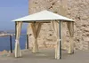 A gazebo with curtains is set up on a stone patio overlooking the sea. Produktbild-Vorschau