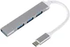 A silver USB C hub with four USB 3.0 ports and a white cable connected to a USB C connector. Produktbild-Vorschau