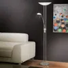 A modern living room scene with a white sofa and a silver floor lamp. Produktbild-Vorschau