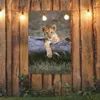 Gartenposter - 80x120 cm - Löwenjunges auf dem Stamm Produktbild-Vorschau 3