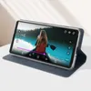A smartphone in a blue case is propped up, displaying a video of a person in a canoe. Anteprima dell’immagine prodotto