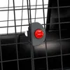 A close-up view of a black wire dog crate door latch with a red button. Anteprima dell’immagine prodotto