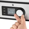 A close-up shot of a person's hand interacting with the control panel of a sous vide cooker. Produktbild-Vorschau
