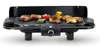 An electric grill with food cooking on it, set against a white background. Náhľad obrázku produktu