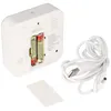 The back of a white digital device, showing the battery compartment with two AA batteries inserted, a detached battery cover, and a white USB cable with a barrel connector. Anteprima dell’immagine prodotto