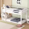 A white wooden bunk bed with bedding is shown in a room with light green walls and a wooden accent wall. Produktbild-Vorschau