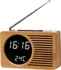 A digital radio with a wooden casing and a digital display showing the time and temperature. Produktbild-Vorschau