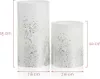 Two white cylindrical candle holders with silver glitter accents are shown with dimensions indicated. Produktbild-Vorschau