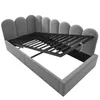 A grey upholstered bed frame with the mattress support mechanism raised. Produktbild-Vorschau