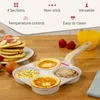 A multi-section frying pan with pancakes and other food items, along with a stack of pancakes and a glass of orange juice on a wooden table. Náhľad obrázku produktu