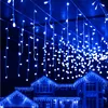 Blue icicle lights decorating the eaves of houses. Náhľad obrázku produktu