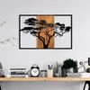 A wall decoration of a tree is displayed above a desk with various items. Anteprima dell’immagine prodotto