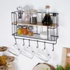 A kitchen shelf with various jars and spice grinders. Anteprima dell’immagine prodotto