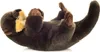 A plush toy otter lying on its back against a white background. Anteprima dell’immagine prodotto