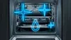 An open oven interior with glowing blue graphics highlighting cleaning features. Produktbild-Vorschau
